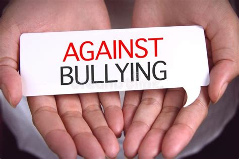 bullying words written  paper  hands stock photo image