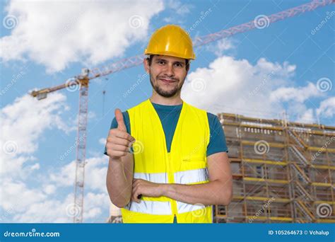 happy worker  construction site  showing thumbs  gesture stock