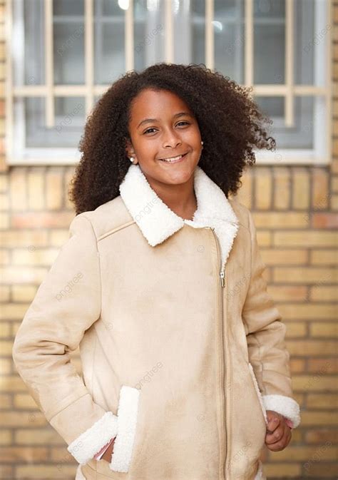 Cute African American Girl Smiling In The Street With Afro Hair