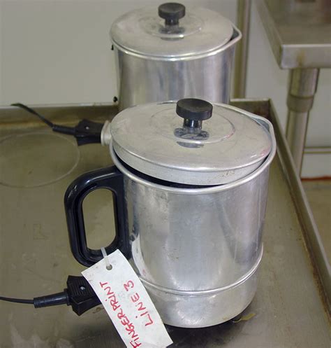 Fbi — Figure 4 Electric Hot Pots Containing Boiling Water