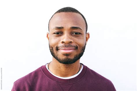 portrait   african american man standing  white  stocksy