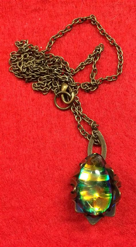 Iridescent Wrapped Resin Pendant And Antique Brass