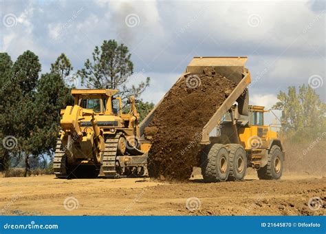 dumping dirt stock photo image  mover excavator bulldozer