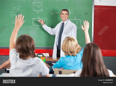 Mature Male Teacher Teaching While Image And Photo Bigstock