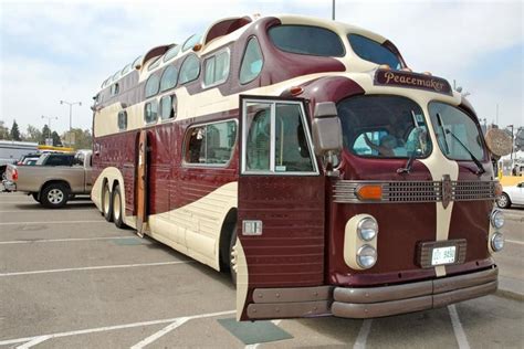 double decker bus parked   parking lot    cars  trucks