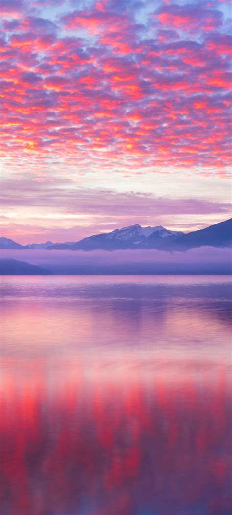 pink clouds wallpaper  reflection lake body  water mountains