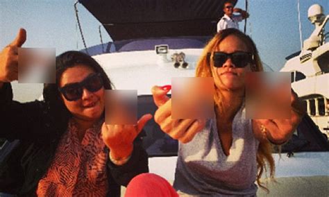 rihanna smugly sticks up her middle fingers as she arrives to istanbul show on a luxury yacht