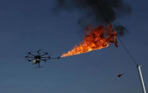 flame throwing drone zaps debris  power lines energy central
