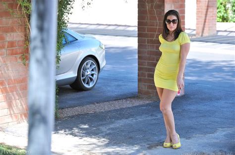 gracie glam a tight fitting yellow dress and matching high heels are