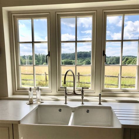 kitchen  double sinks  windows overlooking  field   pictured   image