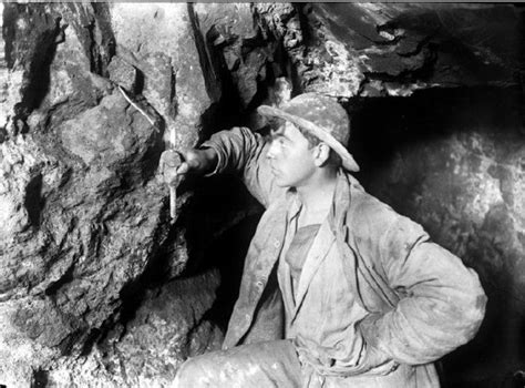 victorian miner about to light a fuse with a candle carbon the giant