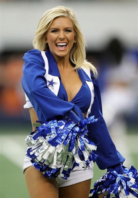 a cheerleader is smiling and dancing on the field