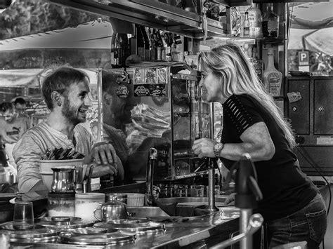 gossip at the coffee bar waitress and customer keep each o… flickr