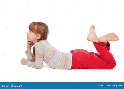 smiling child girl lying  stomach   floor stock photo image