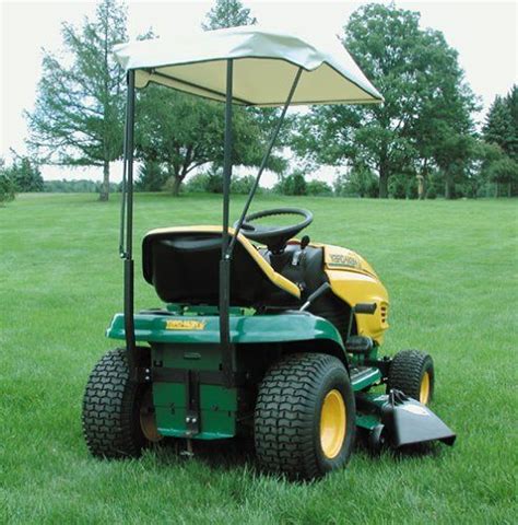 lawn mower sitting   middle   field   canopy