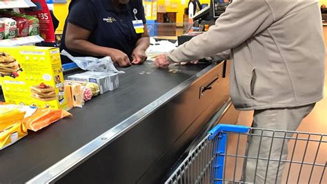 Viral Photo Shows Walmart Cashier Helping Man Struggling To Count