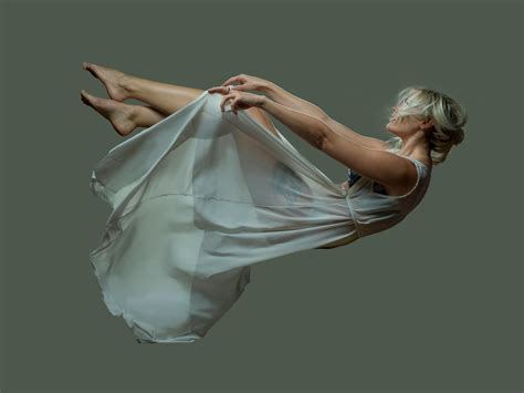 falling woman wearing  sheer dress  stock photo