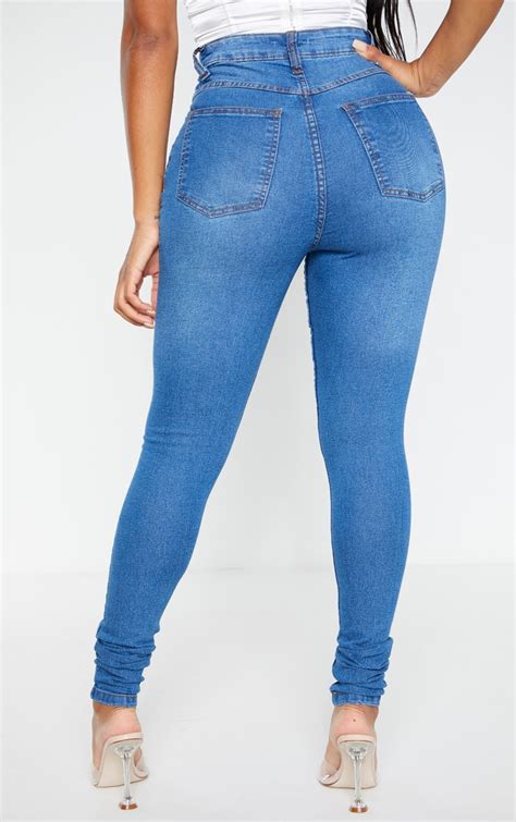 shape mid wash high waist stretch skinny jeans prettylittlething usa