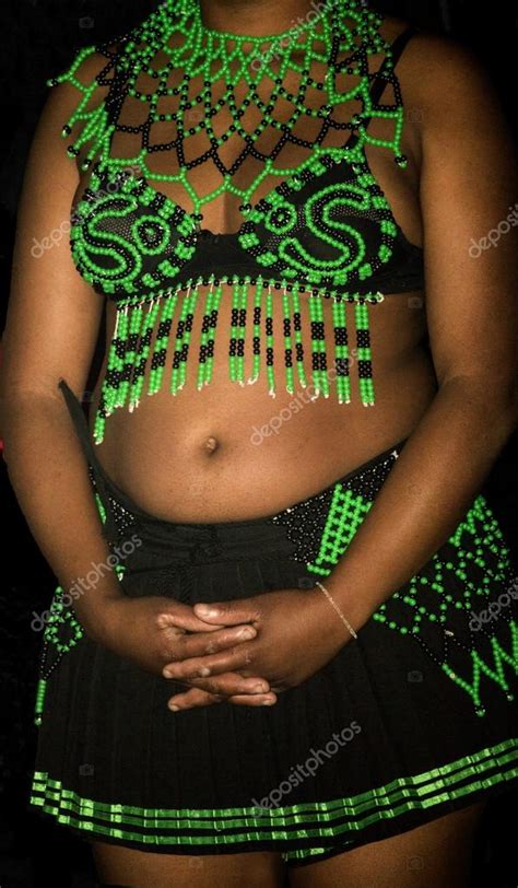zulu woman wearing handmade clothing at lesedi cultural