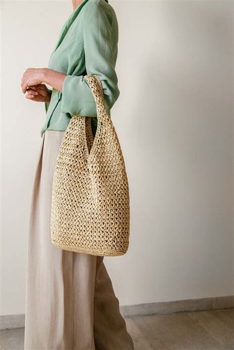 plexida knitwear daphne crochet raffia tote natural nomad concept store