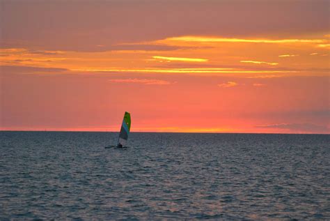 lone sailor  sunset pam raughley cottrell sunset photo contest photo