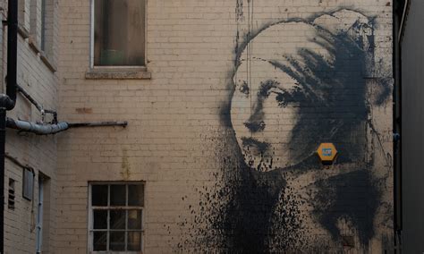 banksy s girl with the pierced eardrum vandalised in bristol art