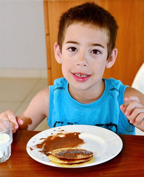 boy eating pancakes stock image image  greece young