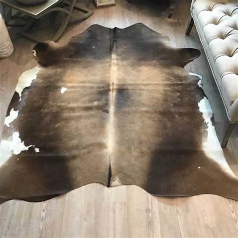cowhide rug large tri colour light centre spine  cowshed interiors notonthehighstreetcom