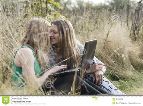 two women friends sitting outdoors together royalty free stock images image 37122979