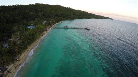 aerial stock drone footage  papua village kids dock