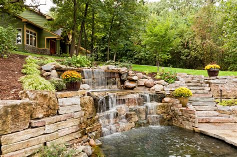 house   hillside features  rolling waterfall   stone