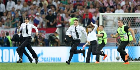 pussy riot members detained after running onto field at world cup final