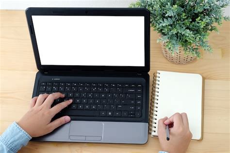 premium photo hand typing laptop  blank screen  writing