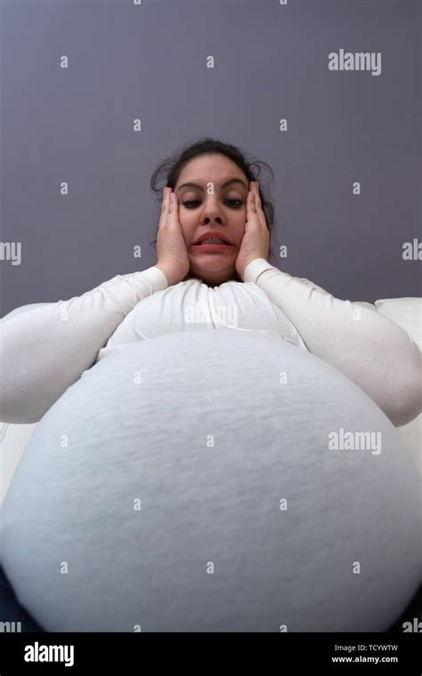 Humorous Shocked Reaction Of Pregnant Mom To Her Big Growing Tummy