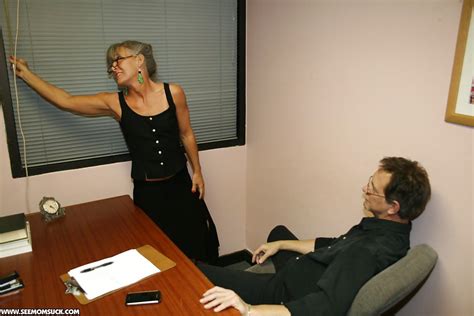 mature secretary in glasses gives a great blowjob to her boss