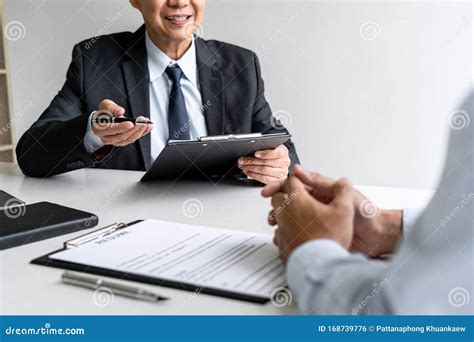 senior committee manager reading  resume   job interview