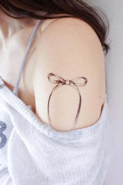 minimal ribbon bow tattoo neck tattoo bow tattoo tattoos  women