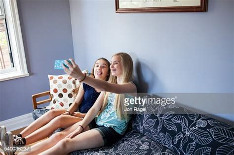 Two Sisters Taking A Selfie Photo Getty Images