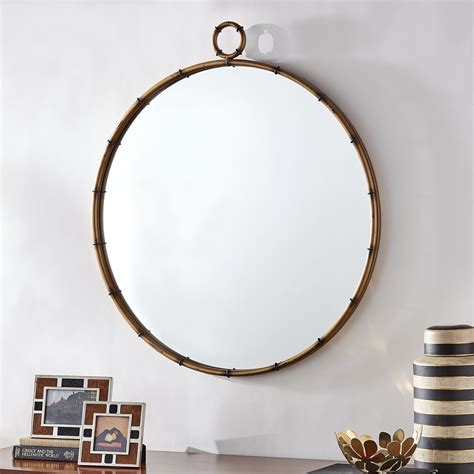 marza antiqued brass finish round wall mirror with decorative ring by
