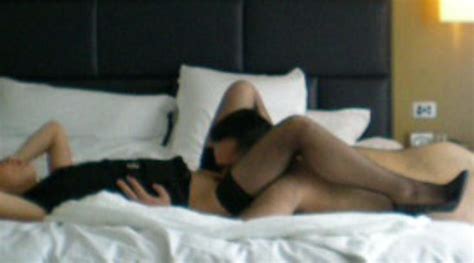asian wife role playing with her boss on business trip at