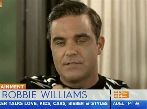 robbie williams admits he s replaced ‘sex with strangers for cake