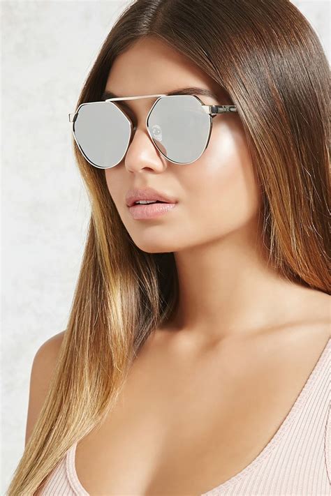 a pair of mirrored sunglasses featuring a bridgeless middle a high