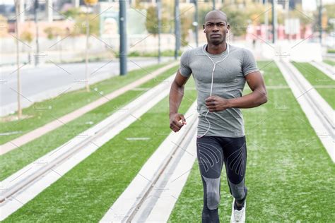 black man running   street high quality sports stock