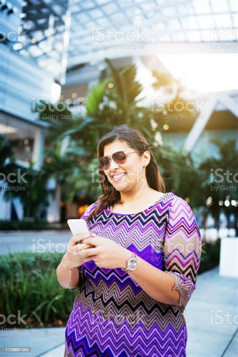 Mature Latina Businesswoman In The Financial District In Miami Portrait