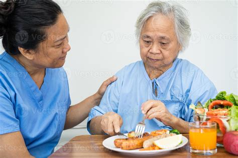 asian senior  elderly  lady woman patient eating breakfast