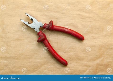 open pliers  red rubber handles   work  clamp parts