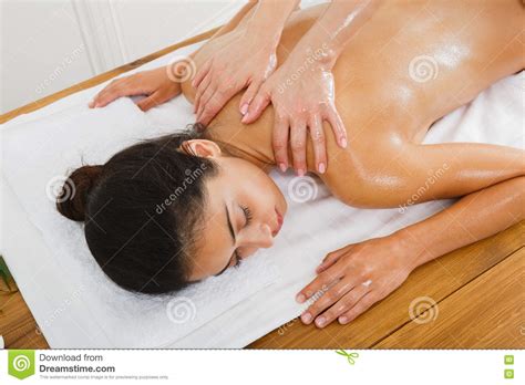 woman massagist make body massage in spa wellness center