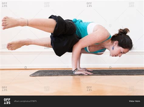 woman   advanced horizontal handstand yoga pose stock photo offset