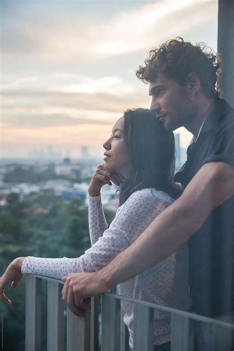 «couple In Love Watching The Sunset From Their Balcony Del Colaborador