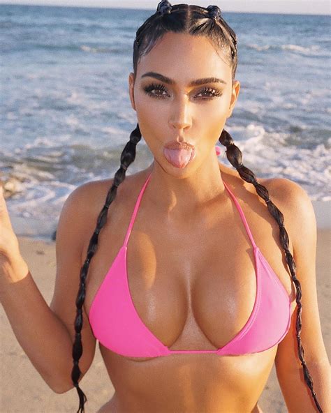 kim kardashian posts hot pink bikini shoot as she spends